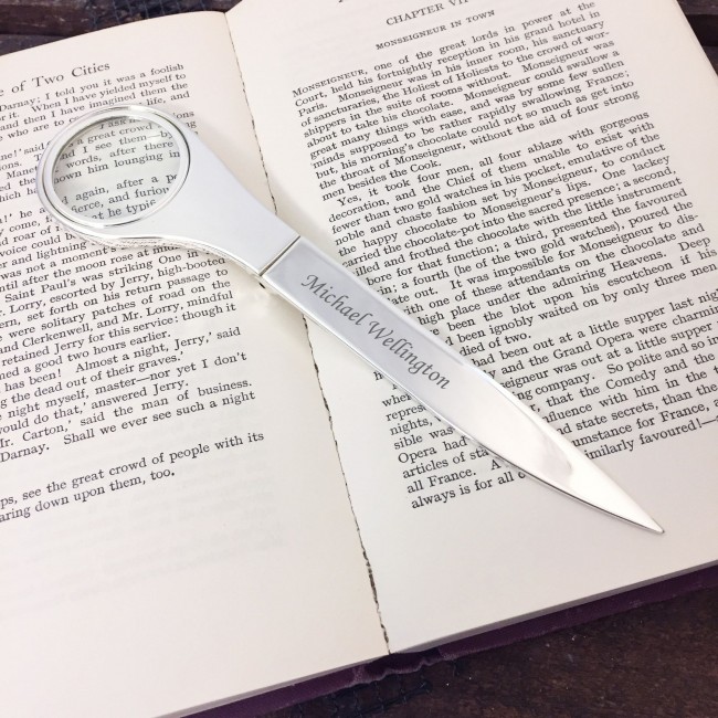 Promotional letter opener with magnifying glass